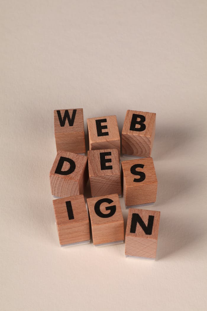 services-01 Wooden blocks arranged to spell Web Design. Perfect for creative, digital content themes.